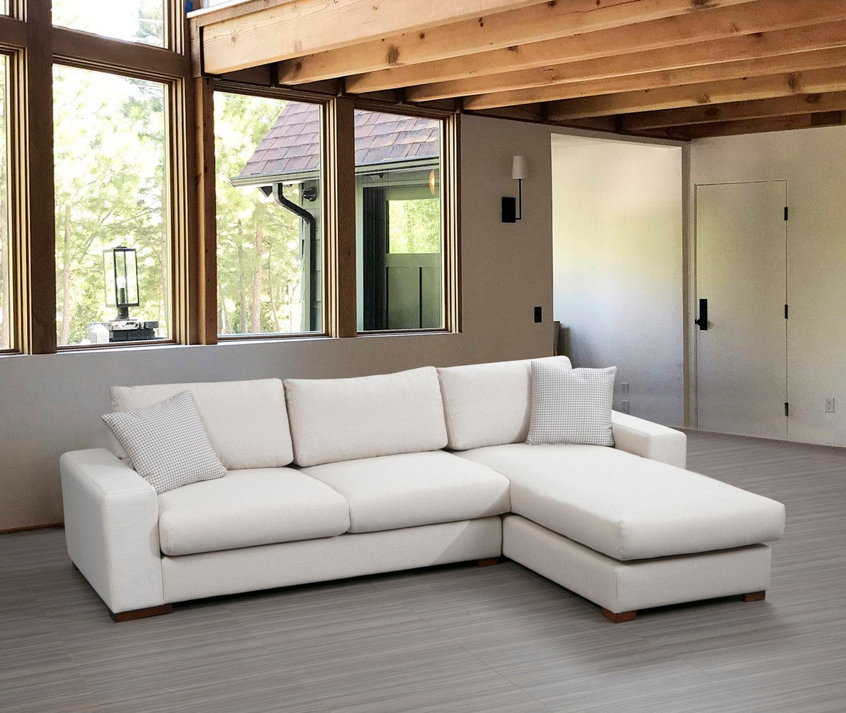 Sofá de canto elegante, 270 x 194 cm, estrutura de madeira de faia, 100% poliéster, pernas de nogueira, almofadas portáteis, lavável a seco, design escandinavo, branco